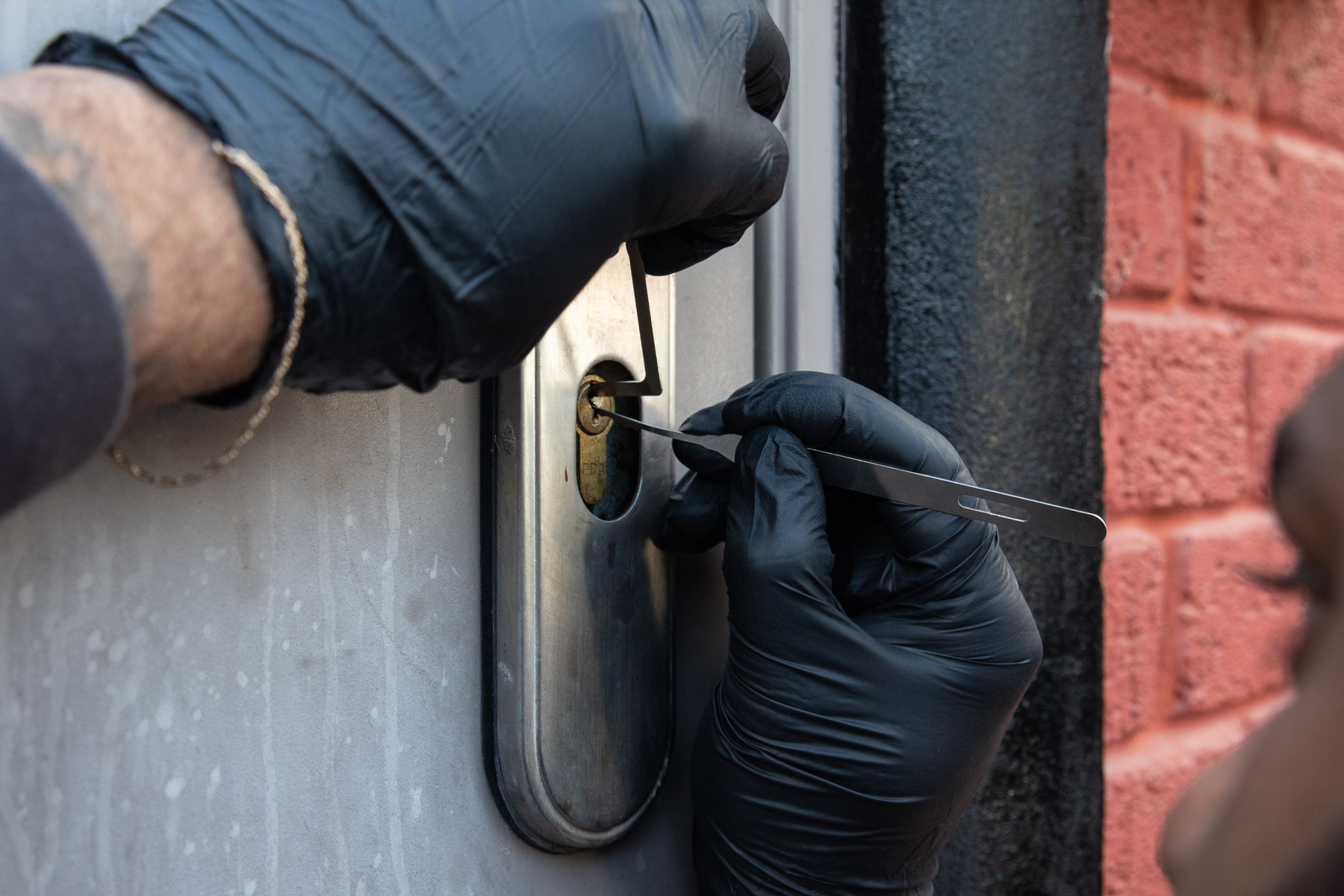 Commercial door lock being picked for non-destructive entry as part of a mobile service provided by AH Locktech