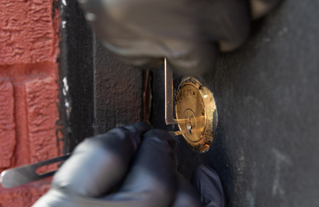 Commercial lock being picked for non-destructive access
