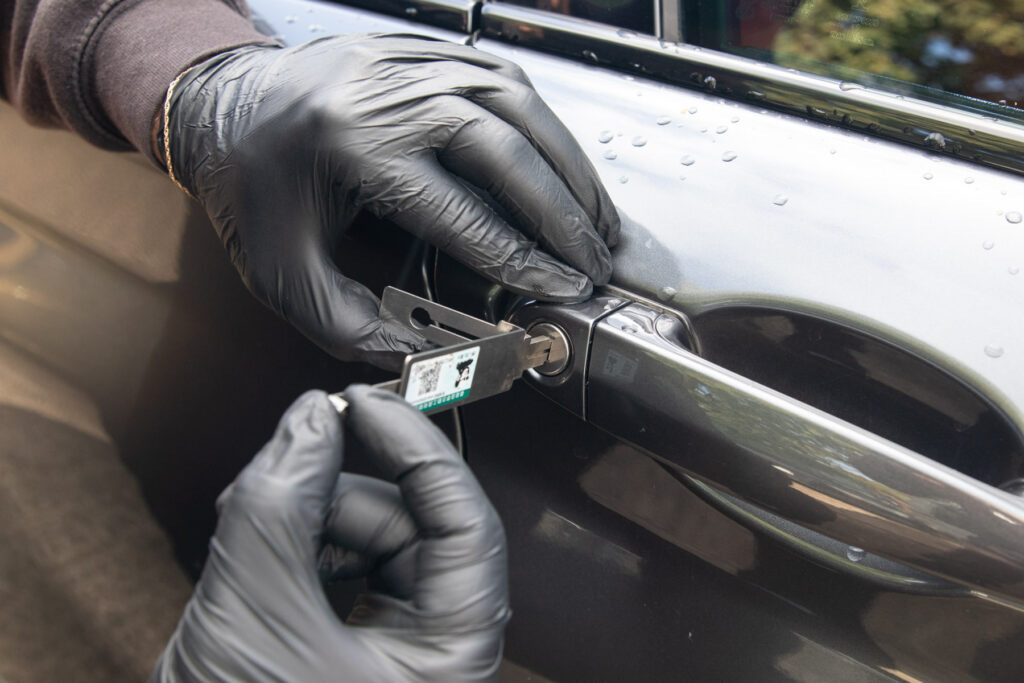 A vehicle door lock being picked to gain entry without causing damage. Carried out by AH Locktech during a vehicle entry call out.